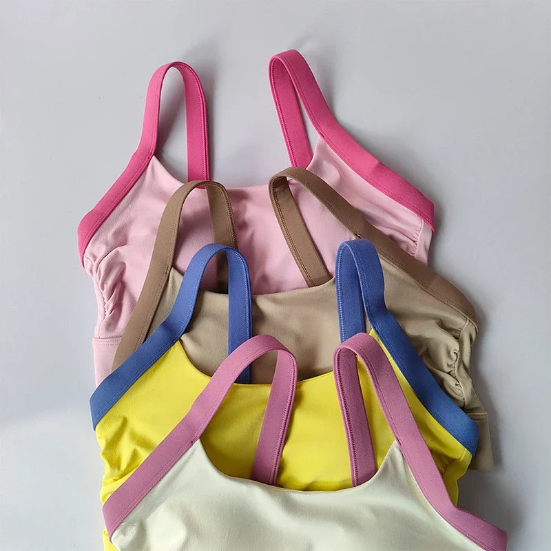 Conjunto de yoga de 2 piezas con espalda cruzada y bloqueo de color de alta intensidad, ropa interior deportiva, leggings de fitness con cintura alta y realce de cadera.