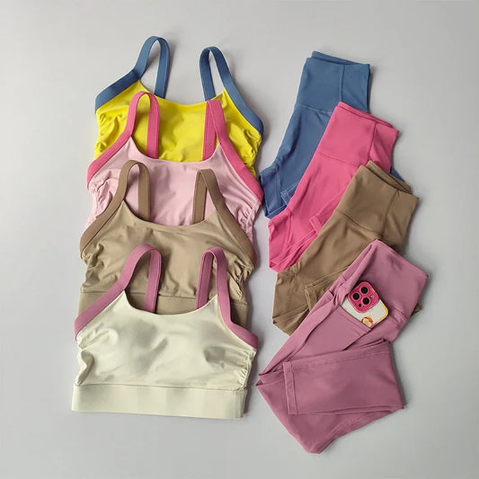 Conjunto de yoga de 2 piezas con espalda cruzada y bloqueo de color de alta intensidad, ropa interior deportiva, leggings de fitness con cintura alta y realce de cadera.